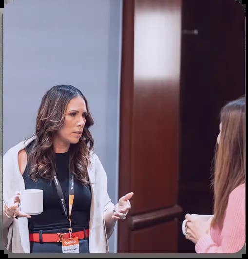 Executive professionals engaging in meaningful conversations at SurveySparrow CX event